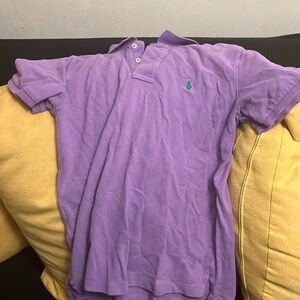 Purple colored polo shirt.